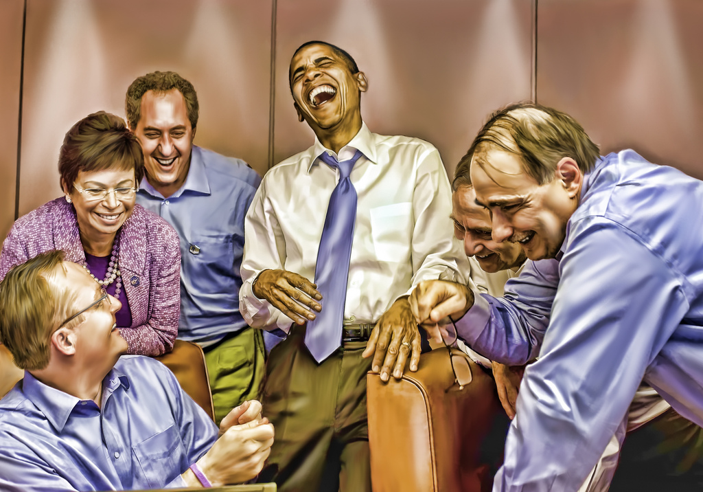 President Obama Laughs with Aides on Air Force One