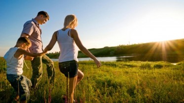 Family-Walking-Field-Sunset-Nature