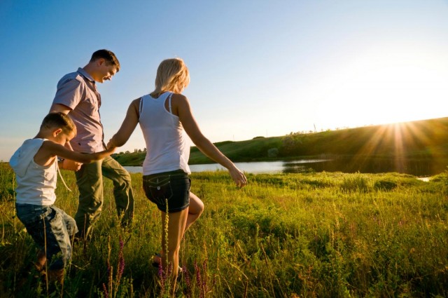 Family-Walking-Field-Sunset-Nature