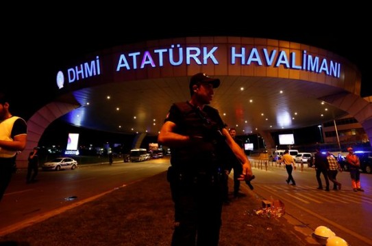 A riot police officer stands guard at the entrance of the Ataturk airport in Istanbul, Turkey, following a multiple suicide bombing, early June 29, 2016. REUTERS/Murad Sezer