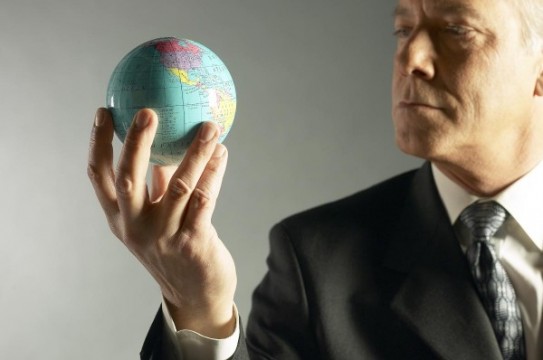 Business-Man-Holding-Globe-Business