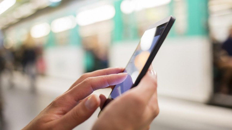 Woman-Using-Her-Cell-Phone-Subway