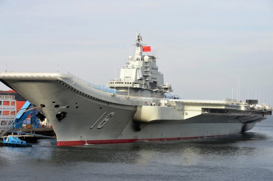 (120925) -- DALIAN, Sept. 25, 2012 (Xinhua) -- Undated photo shows an aircraft carrier berthing in a port of China. China's first aircraft carrier was delivered and commissioned to the Navy of the Chinese People's Liberation Army on Sept. 25, 2012. The carrier, with the name "Liaoning" and hull number 16, was officially handed over to the Navy at a ceremony held in a naval base of northeast China's Dalian Port. (Xinhua/Li Tang) (hdt)